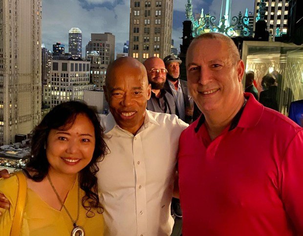 Hui Qin and his former model wife Emma Duo Liu (neither pictured here) hosted Mayor Eric Adams (center) and dozens of others at their luxury penthouse perched atop the Plaza hotel, according to sources. Adams' Director of Asian Affairs Winnie Greco is pictured at left. (Facebook)